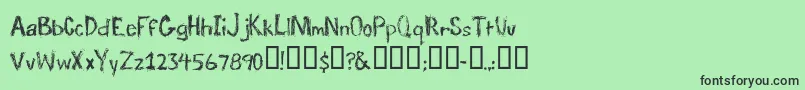 TraumaRegular-fontti – mustat fontit vihreällä taustalla