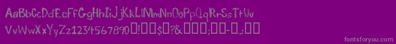 TraumaRegular-Schriftart – Graue Schriften auf violettem Hintergrund