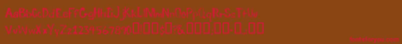 TraumaRegular Font – Red Fonts on Brown Background