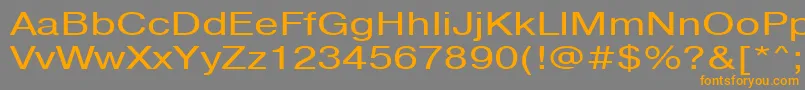 フォントPragmaticactt130n – オレンジの文字は灰色の背景にあります。