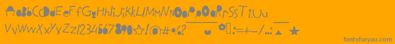 BlackLetters-fontti – harmaat kirjasimet oranssilla taustalla