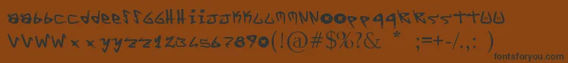 フォントYYoTags – 黒い文字が茶色の背景にあります