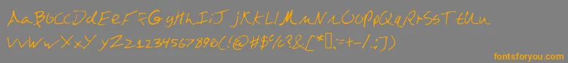 フォントDazebuna – オレンジの文字は灰色の背景にあります。