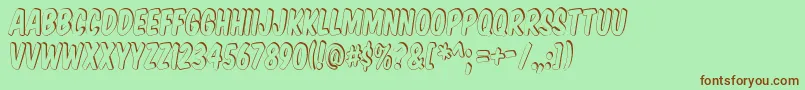 Komtits Font – Brown Fonts on Green Background