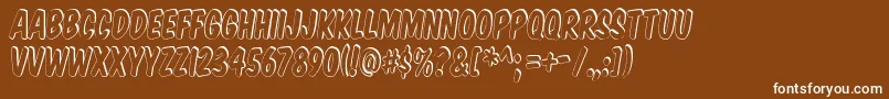 Komtits Font – White Fonts on Brown Background