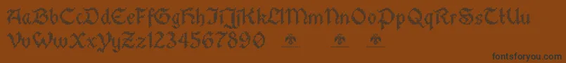 StitchwarriorDemo-Schriftart – Schwarze Schriften auf braunem Hintergrund