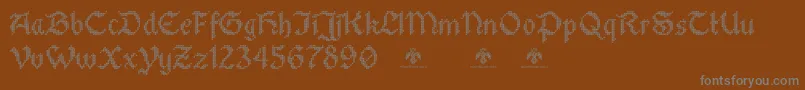 StitchwarriorDemo-Schriftart – Graue Schriften auf braunem Hintergrund