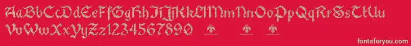 Czcionka StitchwarriorDemo – zielone czcionki na czerwonym tle