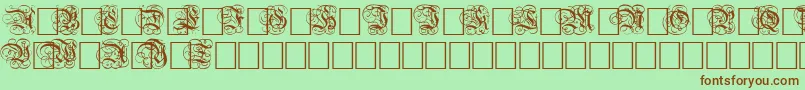 DutchInitialsNormal-fontti – ruskeat fontit vihreällä taustalla