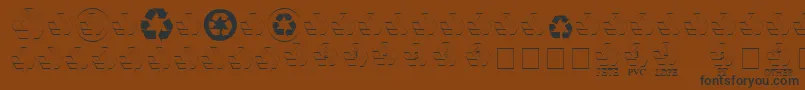 フォントRecycleMedium – 黒い文字が茶色の背景にあります
