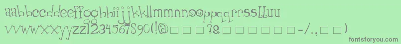 フォントThumping – 緑の背景に灰色の文字