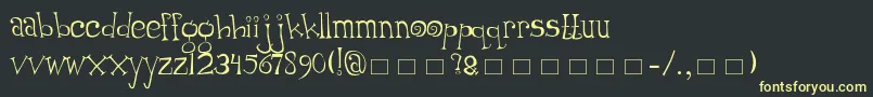 フォントThumping – 黒い背景に黄色の文字