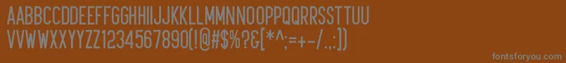 フォントKudajets – 茶色の背景に灰色の文字