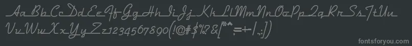 フォントDymaxion – 黒い背景に灰色の文字