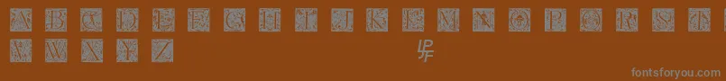フォントGrimeswade – 茶色の背景に灰色の文字