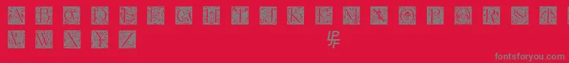 Fonte Grimeswade – fontes cinzas em um fundo vermelho
