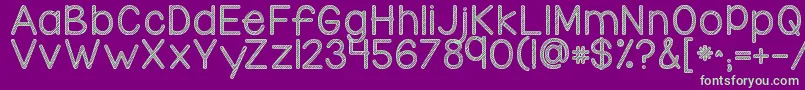 Kgcandycanestripe-Schriftart – Grüne Schriften auf violettem Hintergrund