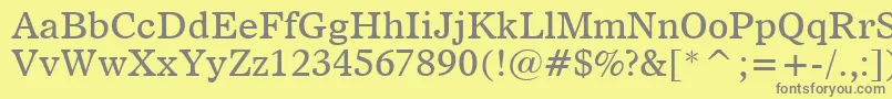 フォントDutch811Bt – 黄色の背景に灰色の文字