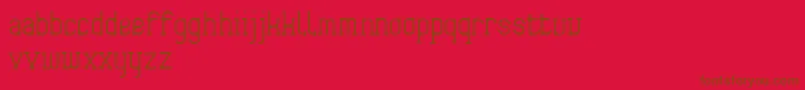 Frida01-Schriftart – Braune Schriften auf rotem Hintergrund
