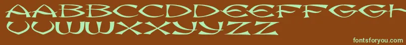 フォントJmhKungFu – 緑色の文字が茶色の背景にあります。