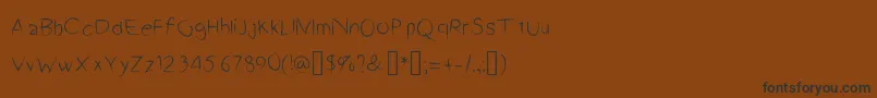 フォントA2Script – 黒い文字が茶色の背景にあります