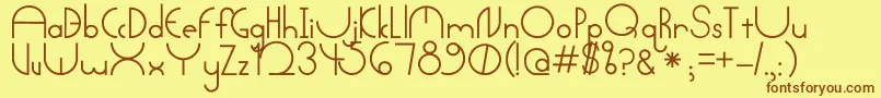 フォントArctic – 茶色の文字が黄色の背景にあります。