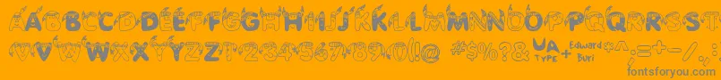 EdbIndians-fontti – harmaat kirjasimet oranssilla taustalla