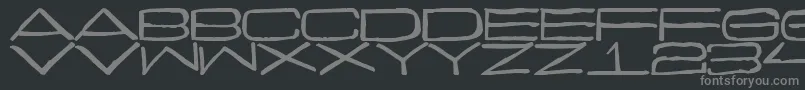 Curmudgeonly-fontti – harmaat kirjasimet mustalla taustalla
