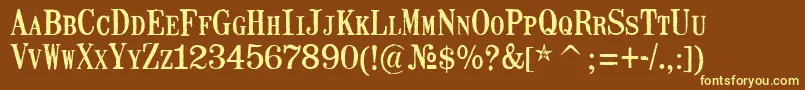 MailartrubberstampRegular-fontti – keltaiset fontit ruskealla taustalla
