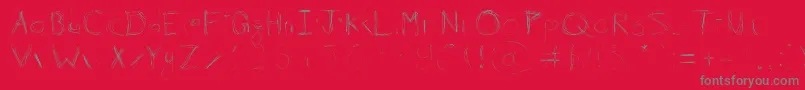 フォント99%Linescratch – 赤い背景に灰色の文字