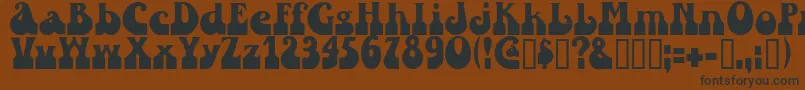 Sandc Font – Black Fonts on Brown Background