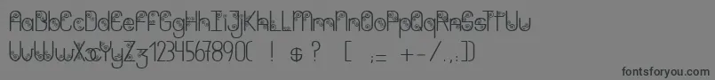 フォントPurpleshadow – 黒い文字の灰色の背景