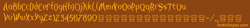 フォントLagegg – オレンジ色の文字が茶色の背景にあります。