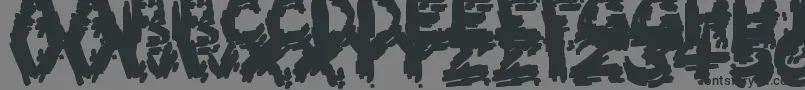 BurntFirewood-Schriftart – Schwarze Schriften auf grauem Hintergrund
