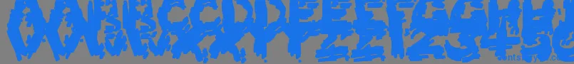 フォントBurntFirewood – 灰色の背景に青い文字