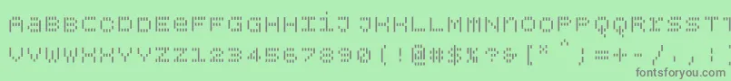 Bpdotsunicaseverticalbold-fontti – harmaat kirjasimet vihreällä taustalla