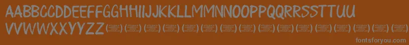 PlayalldayRegular-Schriftart – Graue Schriften auf braunem Hintergrund