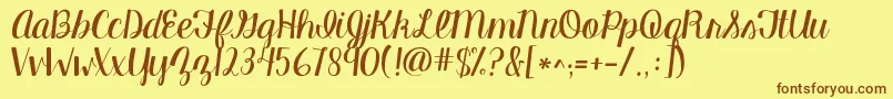 Kgmanhattanscript-Schriftart – Braune Schriften auf gelbem Hintergrund