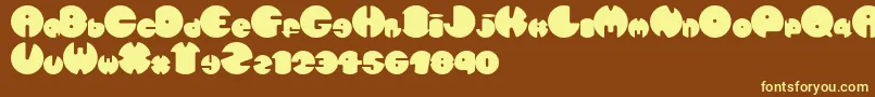 Spherometric-fontti – keltaiset fontit ruskealla taustalla
