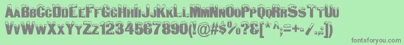 SnowCapsNormal Font – Gray Fonts on Green Background