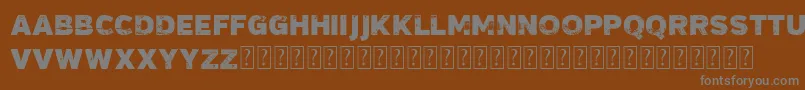 VtksMadalena-Schriftart – Graue Schriften auf braunem Hintergrund