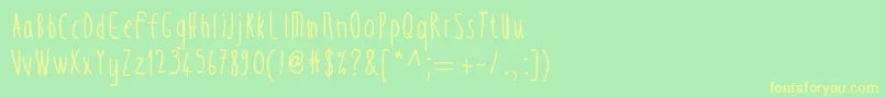 フォントThintall – 黄色の文字が緑の背景にあります