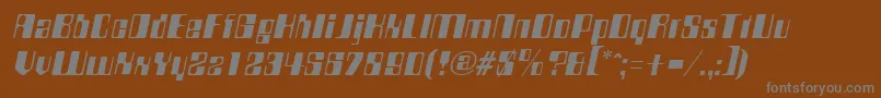 CompstyleItalic-fontti – harmaat kirjasimet ruskealla taustalla