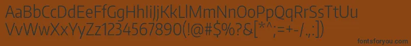 Czcionka EncodesanscondensedLight – czarne czcionki na brązowym tle