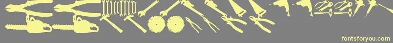 ToolzTfb-Schriftart – Gelbe Schriften auf grauem Hintergrund