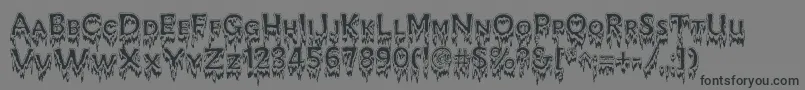 フォントKreepshowFrigid – 黒い文字の灰色の背景