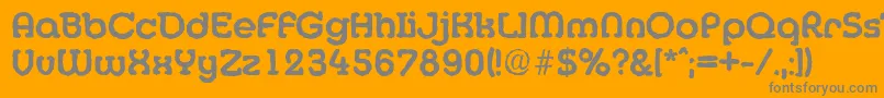 MexicoantiqueBold-fontti – harmaat kirjasimet oranssilla taustalla