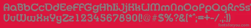 MexicoantiqueBold-fontti – harmaat kirjasimet punaisella taustalla