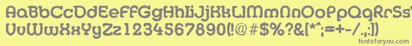 MexicoantiqueBold-fontti – harmaat kirjasimet keltaisella taustalla