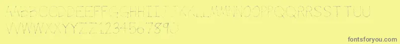 フォントAirbrush – 黄色の背景に灰色の文字